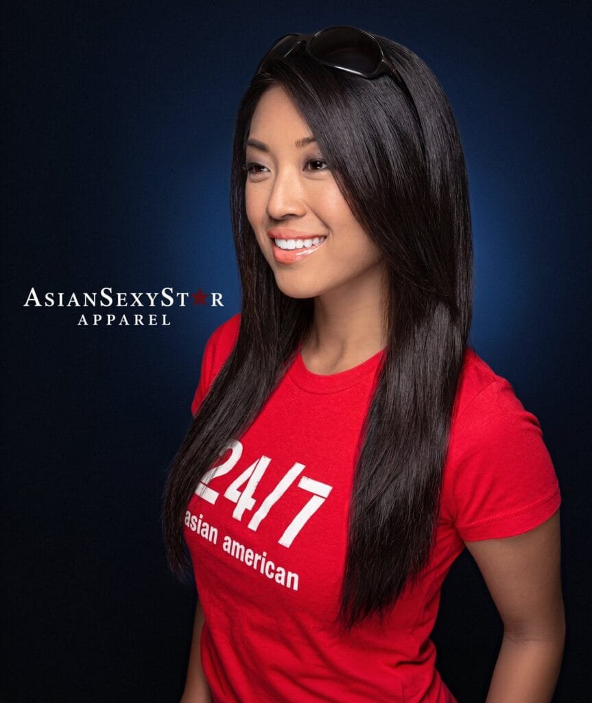 Model in a red Asian Sexy Star Apparel tee reading 24/7 Asian American